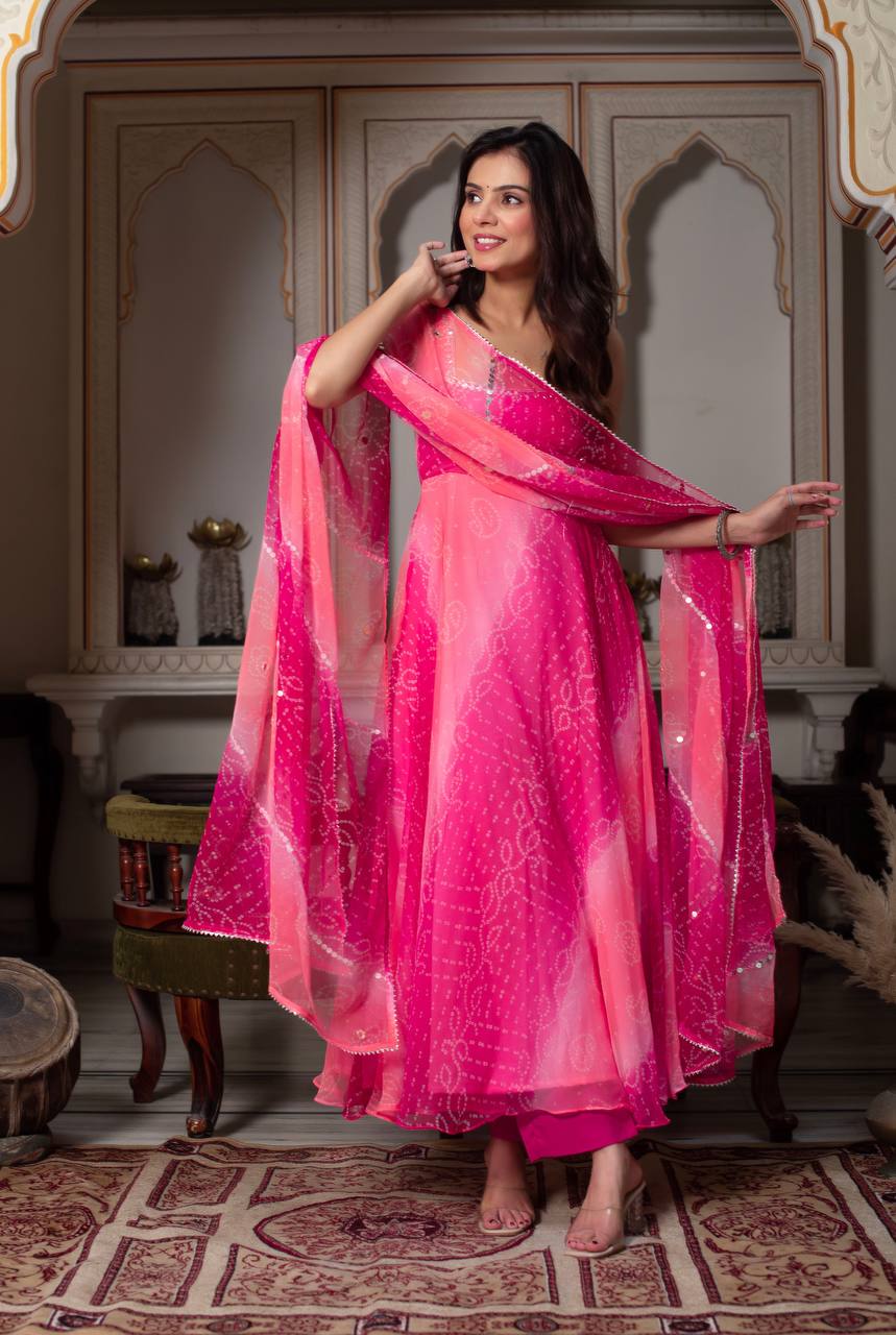 Festive Rani Pink Anarkali with mirror work & fancy lace dupatta.
