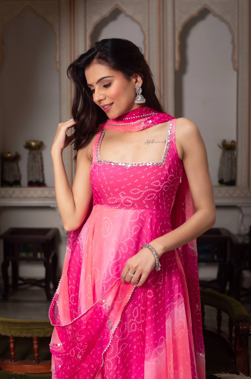 Festive Rani Pink Anarkali with mirror work & fancy lace dupatta.